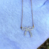 Cz stone bow tie pendant